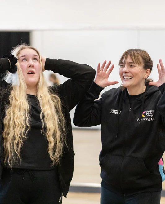 Lecturer laughing with students during an engaging group activity at Glasgow Kelvin College. Lecturer laughing with students during an engaging group activity at Glasgow Kelvin College.